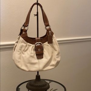 Coach cream and brown leather purse.
